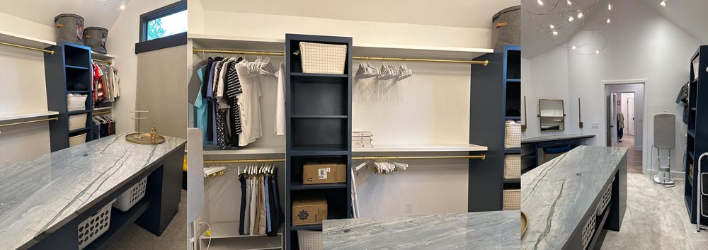 A spare bedroom remodeled into a huge master closet with a makeup vanity, hanging rods, shelving, and a large island for folding clothes.